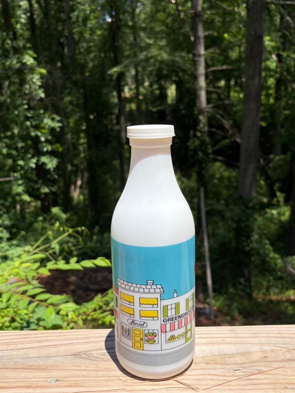 White Milk Bottle with Blue Illustrated Label